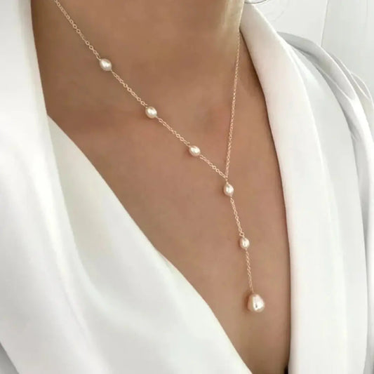 Margrit – Collar dorado con delicada cruz - Elena Duval